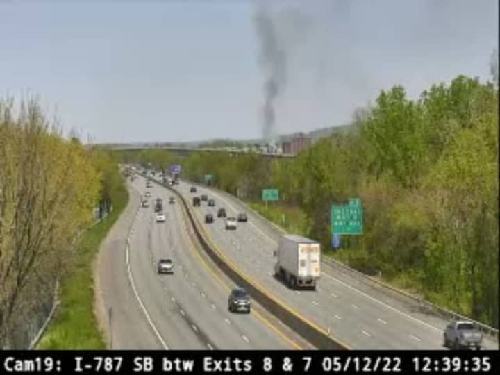 Smoke from an apartment fire on Starbuck Island in Green Island is visible from I-787 Thursday, May 12.