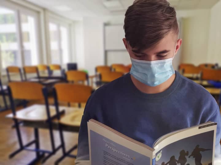 An American professional association of pediatricians is recommending that students wear masks when they return to the classroom this fall, regardless of their vaccination status, in a departure from newly-released guidance from the Centers for Disea