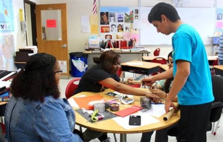 Students work together on a class project at Summit Academy in Peekskill.
