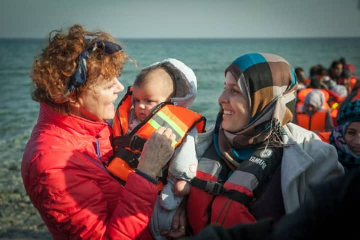 Actress Susan Sarandon, a former Pound Ridge resident, holds a tiny baby as she talks to Syrian refugees on the Greek island of Lesbos.