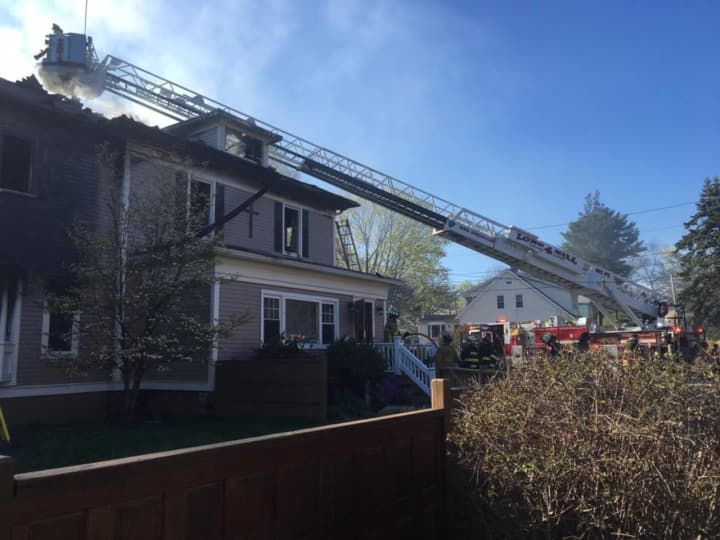 Firefighters tackle the blaze at 175 White Plains Road, the home of the Blessed Lamb Preschool and Blessed Assurance Prayer Community, in Trumbull.