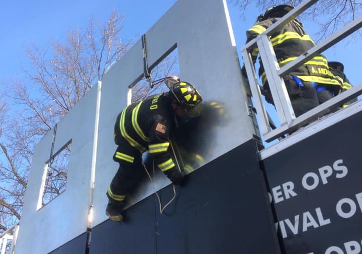 The system allows firefighters to descend from upper floors quickly.