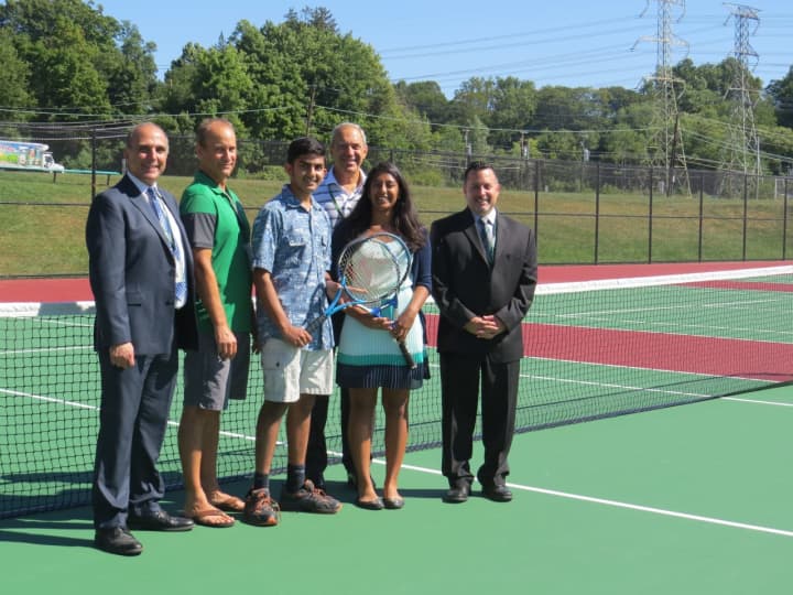 On the new tennis courts are, from left: Superintendent Ralph Napolitano, Coach Roger Dayer, boys varsity team captain Sidharth Anand, athletic director Fio Nardone, girls varsity team captain Anisha Duvvi and high school principal Joseph DeGennaro.