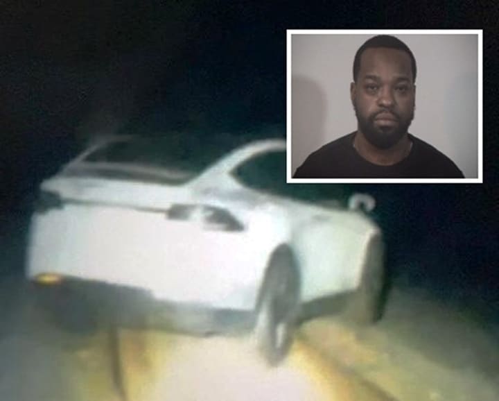 Bendrick Smith was arrested after his Tesla got stuck on railroad tracks.