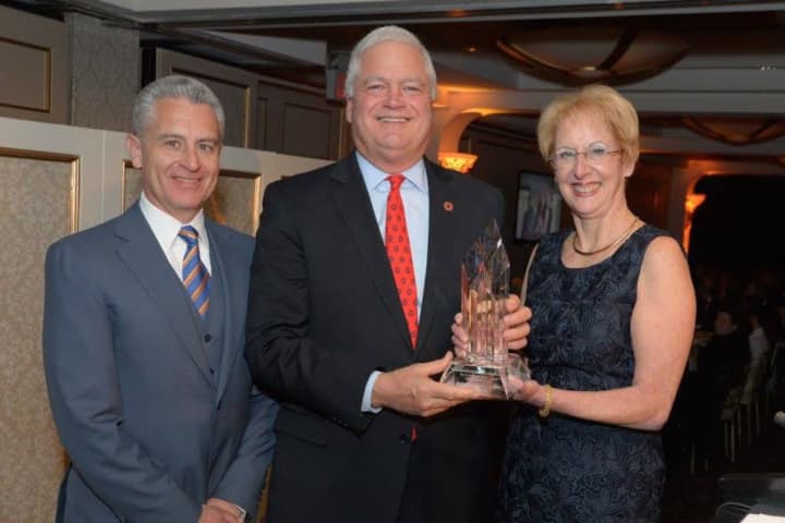 John Tolomer, Bank President &amp; CEO (center) accepts the award from the Business Council of Westchester’s Anthony Justic and Marsha Gordon.