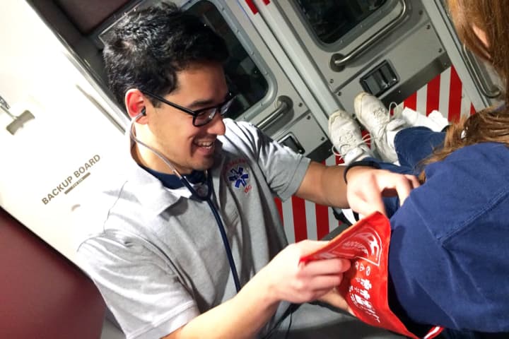 North Salem Volunteer Ambulance Corps member Tomo Monte shown measuring blood pressure.