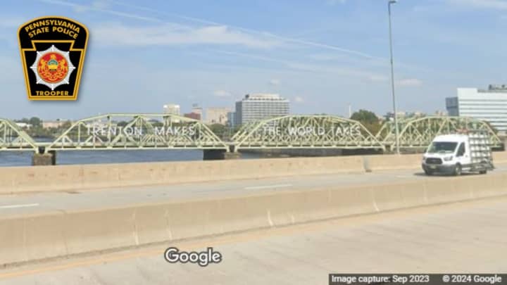 The Trenton Morrisville Toll Bridge. The Lower Trenton Bridge and Trenton skyline are visible in the background.&nbsp;