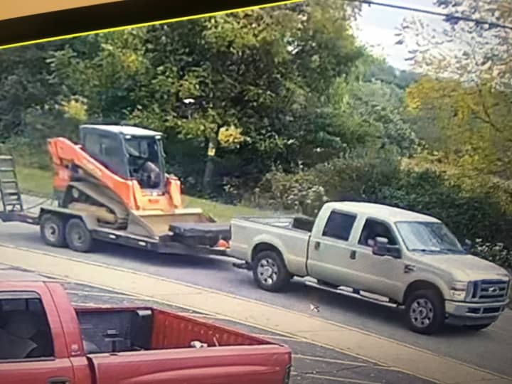The vehicle involved in the incident was identified as a tan-colored Ford quad cab pick-up truck pulling an open trailer that contained a Kubota orange skid steer pictured above, authorities said.