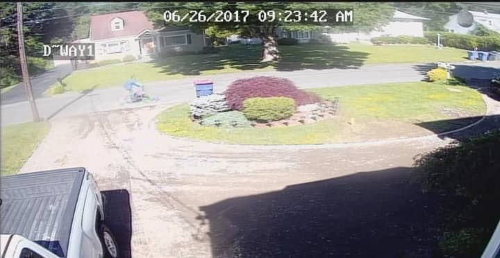 Surveillance footage of a suspect in a pair of home burglaries in Trumbull on Monday. The suspect is described as a white, possibly Hispanic, male on a bicycle