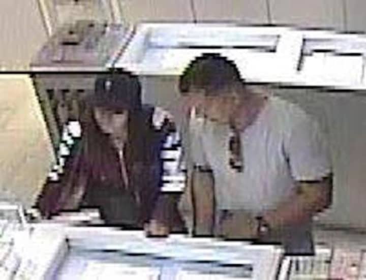 Surveillance footage of two suspects in the theft of jewelry at the Westfield Trumbull Mall.