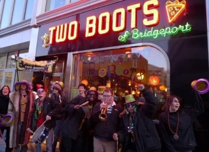 Two Boots customers party outside the downtown Bridgeport restaurant. The popular food and music venue closed its downtown Bridgeport location this week due to financial struggles.