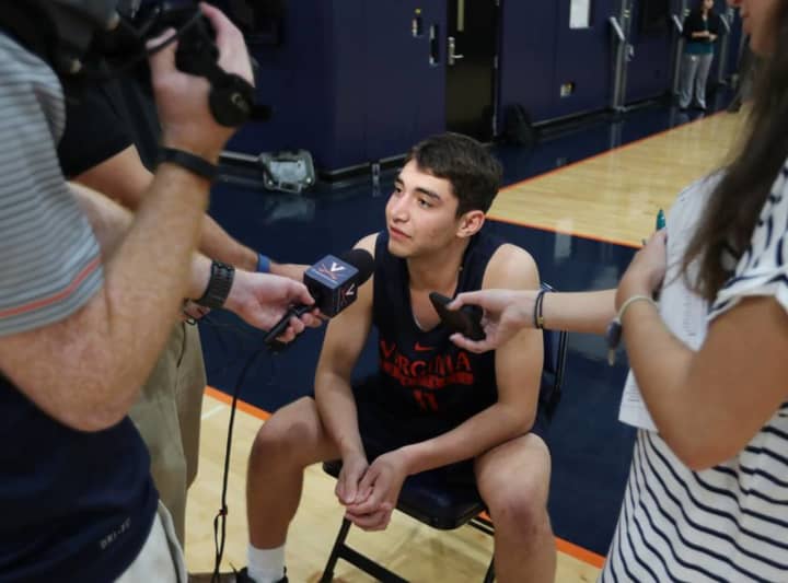 Ty Jerome of New Rochelle, a former basketball star at Iona Prep, answers questions at the University of Virginia&#x27;s Media Day. Jerome is a freshman for the Cavaliers.