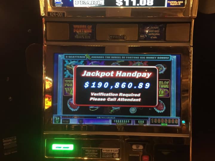 Her $4 wager on the penny-denomination Wheel of Fortune slot machine in the casino&#x27;s Gotham Palace at 8:57 p.m. pulled down the first six-figure jackpot of the year at the Yonkers casino.
