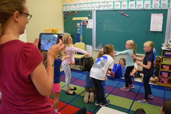 Bronxville Elementary first-grade students act out an Australian folktale while their teacher films them, as part of training on iMovie through the Jacob Burns Film Center.