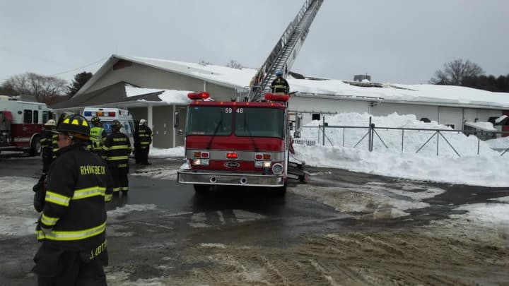 Rhinebeck firefighters had to evacuate Williams Lumber after the roof collapsed from too much snow.
