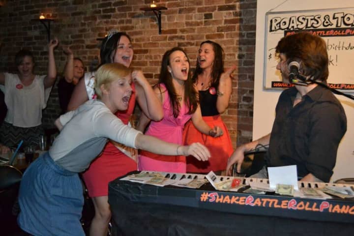 Singing is part of the experience with Shake Rattle &amp; Roll Dueling Pianos .