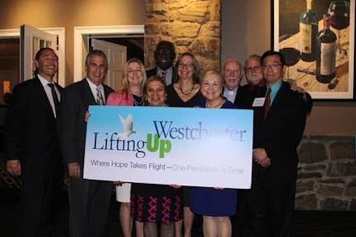 Members celebrate the fundraising efforts of Lifting Up Westchester.