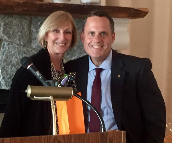 Immediate past president of the Rye Rotary Club Pamela Dwyer with new president Jason L. Mehler.