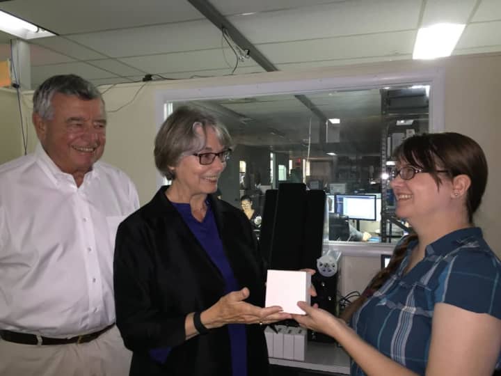 Bob Riggs, Co-Chair of the Eastchester 350th Anniversary committee, and Eloise L. Morgan, 
Bronxville Village Historian, deliver the first of 114 microfilm reels of old local weekly newspapers to an employee (right) of Hudson Archival.