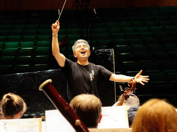Conductor Jun Nakabayashi, rehearses the Festival Orchestra.