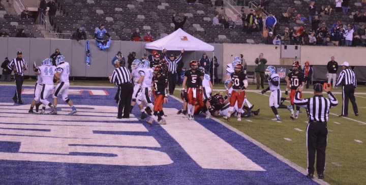 Officials signal for a touchdown on the first score of the Mahwah versus Glen Rock football championship game at MetLife Stadium Friday, Dec. 4.