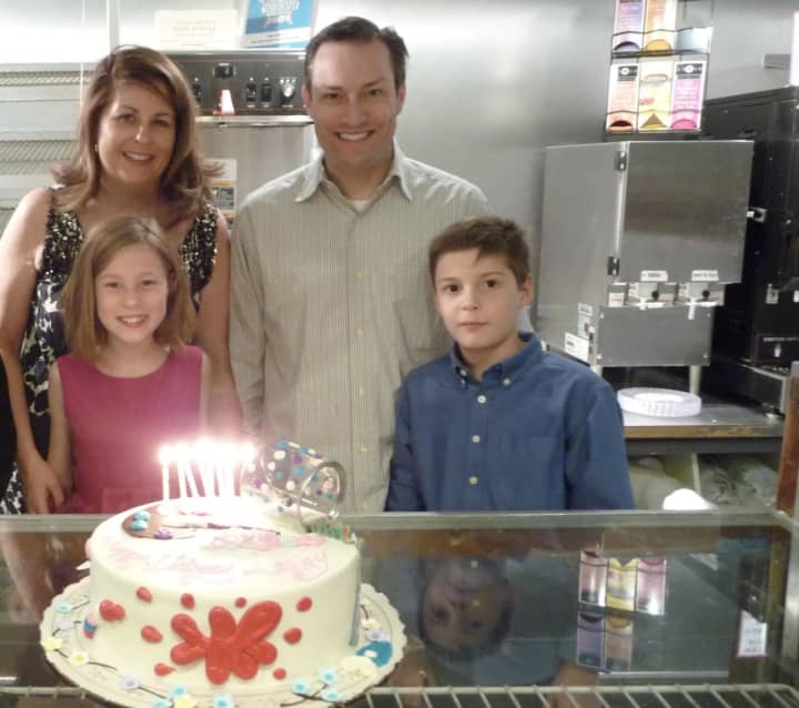 Jacqueline and R. Heath at one of their children&#x27;s latest birthday parties at Topps Bakery in Bronxville. The event naturally featured three cakes.