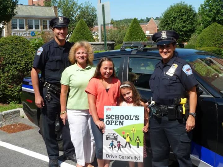 Tuckahoe Police Officers Vincent Pinto and Emily Yankowski helped to launch AAA’s “School’s Open – Drive Carefully” campaign at police headquarters in Tuckahoe, NY with Olivia and Gianna Solano.  Donna Galasso, Assistant Director, Traffic Safety.
