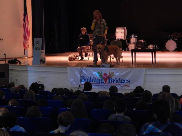 Tuckahoe students were introduced to Tuna, a canine assistance dog as part of the &quot;building bridges&quot; program.