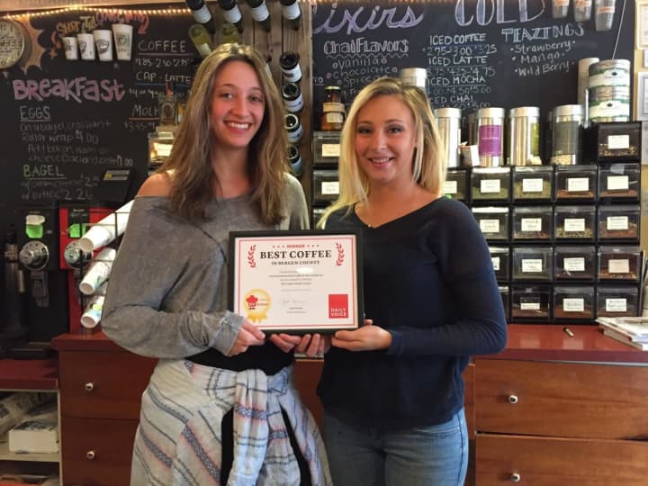 Cool Beans employees Kim Pfeifer, left, and Grace Prisco accept the DVlicious award.