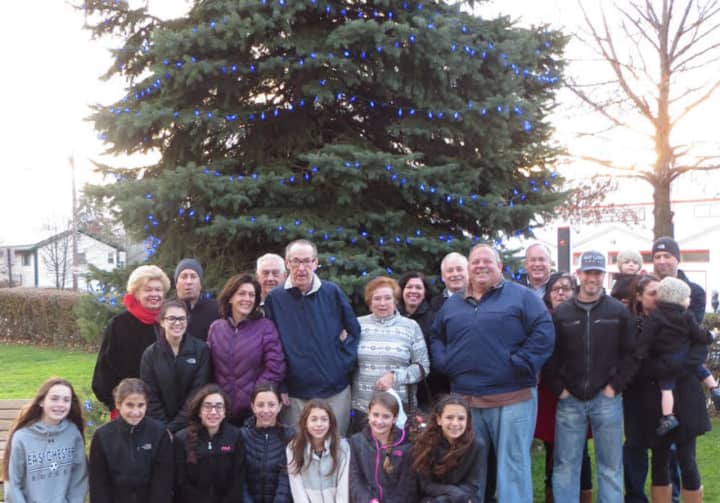 Local officials and community members at tree-lighting.