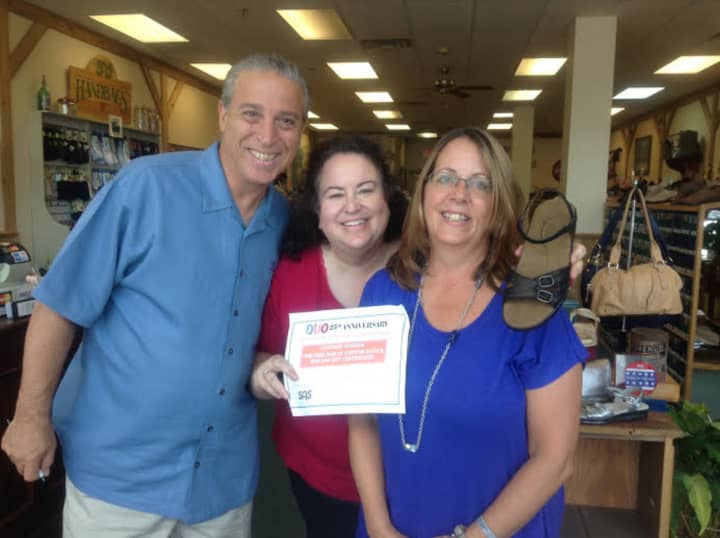 Steve Castellano, left and Cindy Castellano, right, of SAS Shoes in Yonkers, with Michele Trommer, center.
