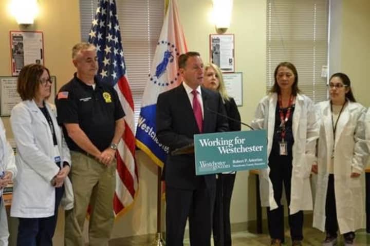 Rob Astorino with health department officials announcing the county has vaccinated nearly 3,000 people for hepatitis A.
