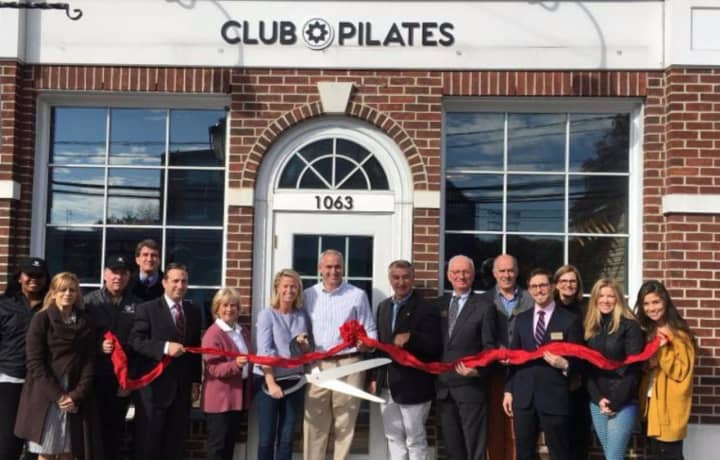 Scott and Nina Ackerman (owners) with Darien local officials, Chamber Board of Directors and Club Pilates staff at the ribbon cutting