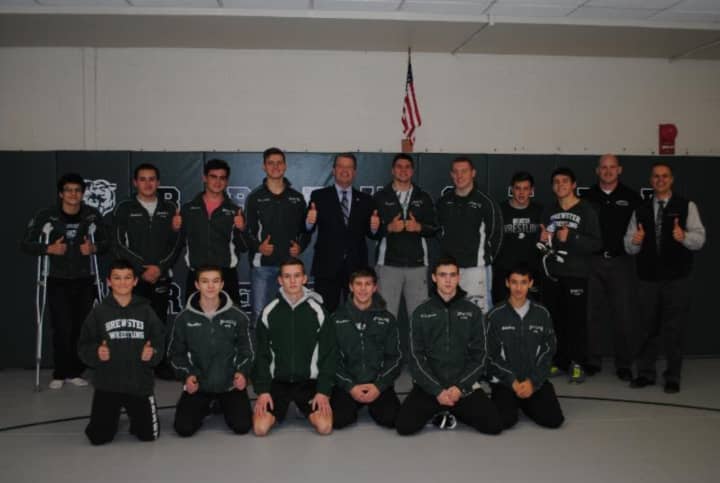 New York State Senator Terrence Murphy delivered a $25,000 grant to the Brewster School District, which helped pay for the installation of new mats in the Brewster wrestling room.