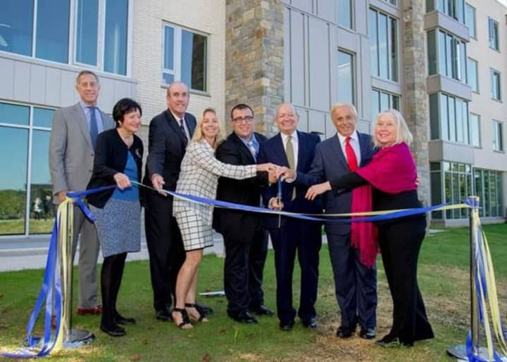 Officials gather at Pace University to cut the ribbon on Elm Hall on Thursday.