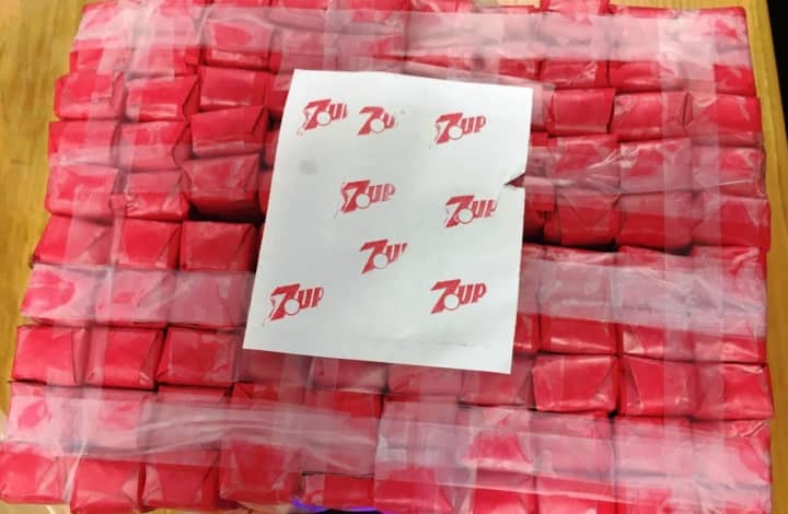 Two men were arrested at the Cross County Shopping Center in Yonkers with heroin marked as 7-Up.