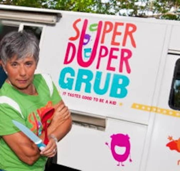 Laura Bonilla strikes a pose outside her Super Duper Grub food truck.