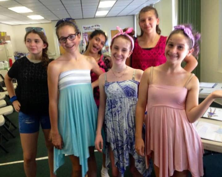 Campers from Camp Groovy on Grand model their fashions during 2015&#x27;s camp.