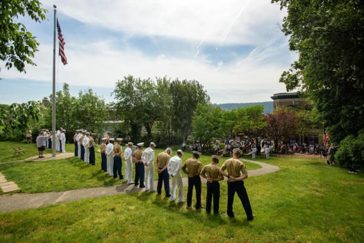 Sailors and Marines stand guard in front of the James Daly Post 200 VFW Hall at the Moment of Silence for Fallen Hero’s at the Hastings on Hudson Memorial Day Parade