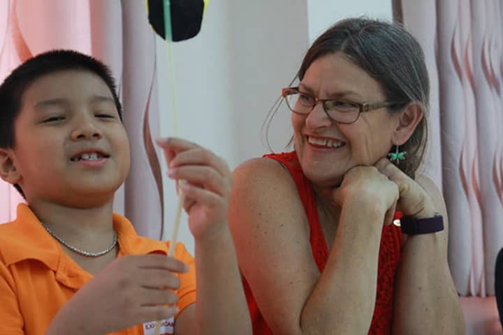 New Rochelle educator Elizabeth Barrett-Zahn teaching in Vietnam.