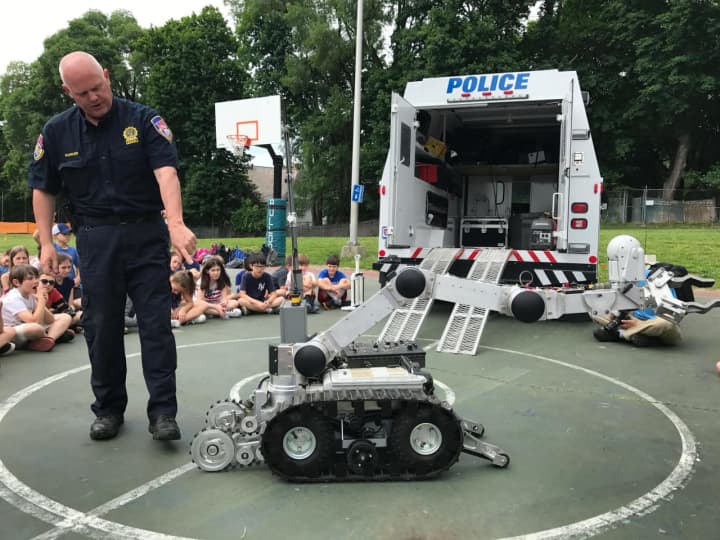 Westchester County Police Detective Thomas Barker demonstrated
how the department’s Hazardous Devices Unit robot operates and explained how
it’s utilized during a special visit to Main Street School on June 7.