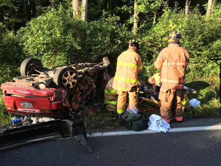 Two men were injured in a two-car rollover crash in Milan.