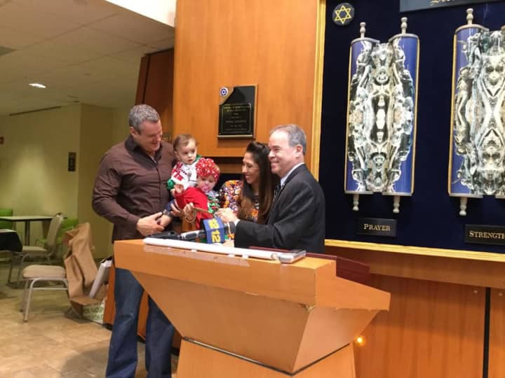 Ivey Mackle and her family accept to the Key to the County from County Executive Ed Day for standing up to acts of hate in her neighborhood.