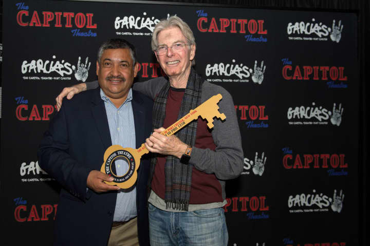 Phil Lesh receives the key to the Village of Port Chester from Port Chester Deputy Mayor Luis Marino.