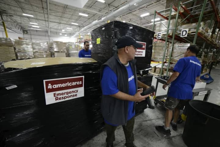 Workers at the U.S. distribution center for Americares prepare to send medicine and relief supplies to Haiti after Hurricane Matthew ravaged the area.