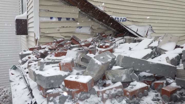 One resident was displaced after the facade of an apartment complex came apart.