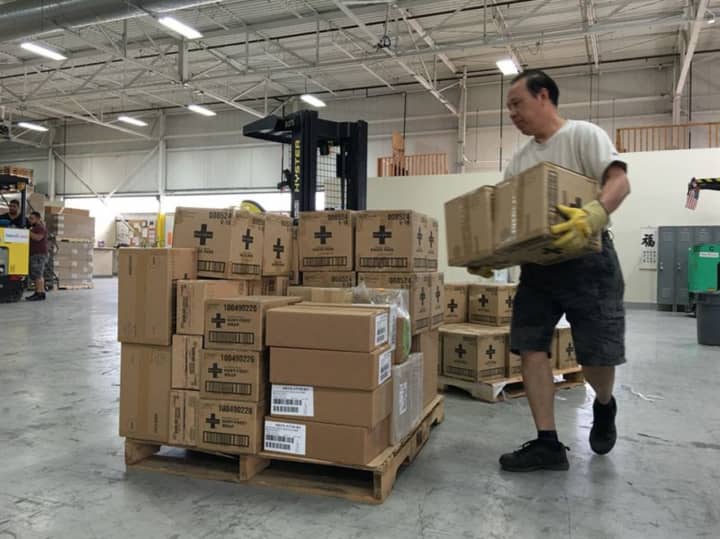 Americares prepares a shipment of first aid supplies in its Stamford warehouse earlier this year.