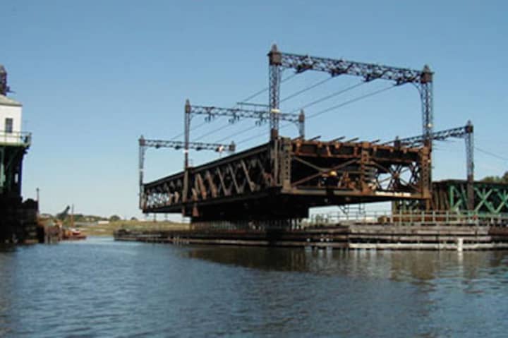 The Walk Bridge, which carries four train tracks for Metro-North and Amtrak, swings open to allow marine traffic to move through Norwalk Harbor.