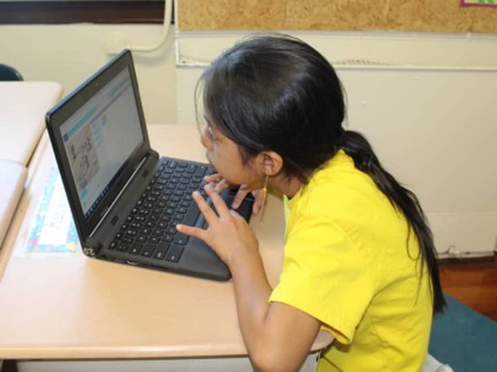 Students from three local elementary schools recently took part in the &quot;Hour of Code&quot; that teaches students how to code. This student works at Washington Irving Elementary School.