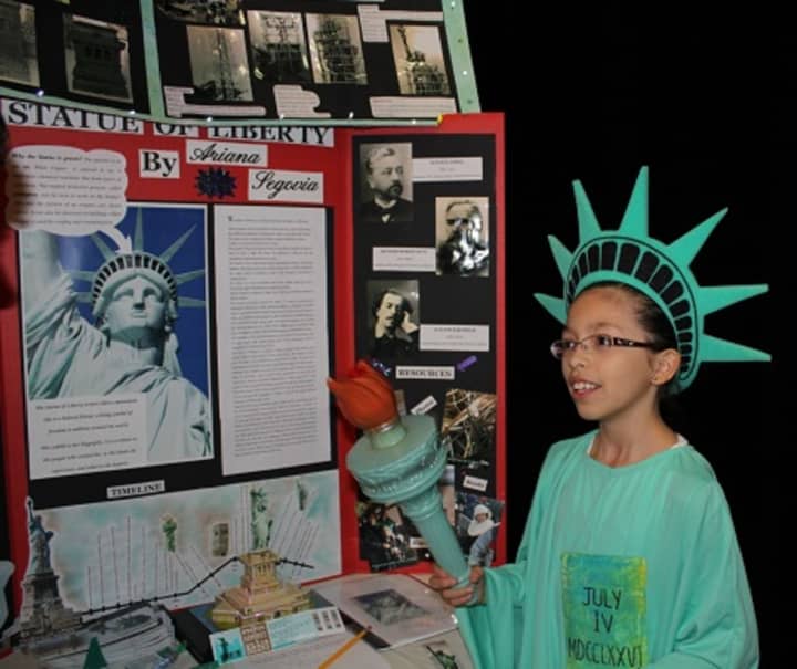 A student presents on the Statue of Liberty.